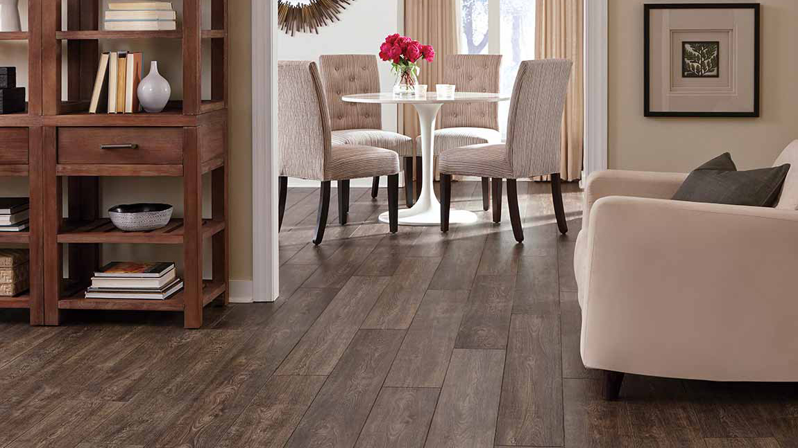 Laminate flooring in a dining room, installation services available.